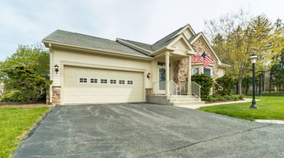 Exterior view of a senior living facility with a front porch