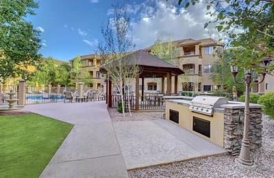Vibrant outdoor space with pool and grill area