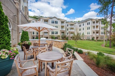 Outdoor seating area with tables and umbrellas
