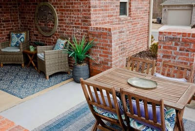 Cozy outdoor seating area with a wooden table and chairs