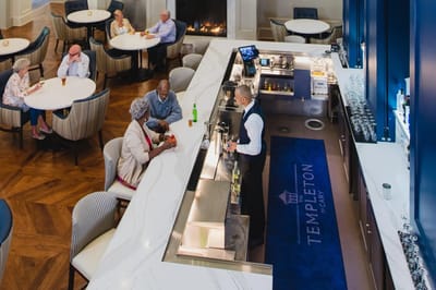 Residents enjoying drinks in a spacious common area