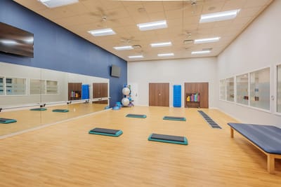 Bright interior activity room with fitness equipment
