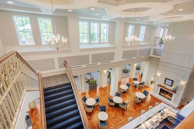 Bright common area with stairway and seating