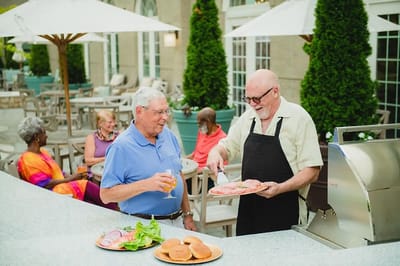 Residents enjoying a barbecue on the patio