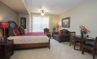 Private resident room with bed and seating area