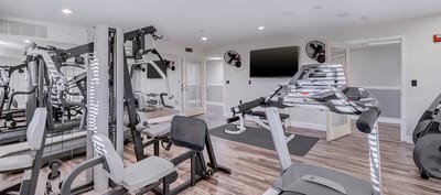 Well-equipped fitness room with exercise machines