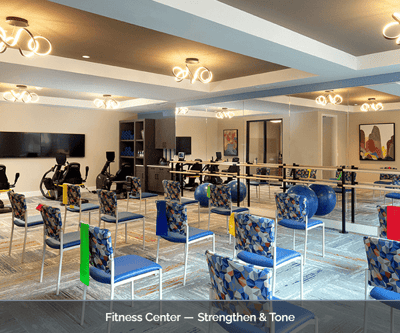 Bright fitness center with exercise equipment and chairs
