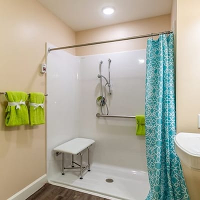 Accessible bathroom featuring a shower and safety features