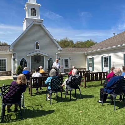 Residents attending a gathering in the outdoor space