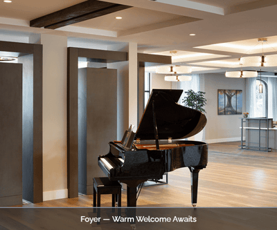 Interior view of a foyer with a grand piano