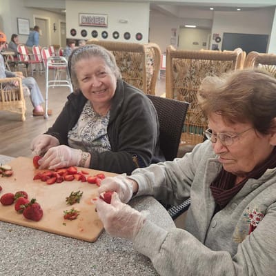 Residents engaging in food preparation activity