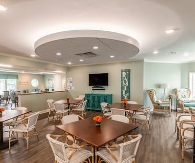 Bright dining area with tables and chairs