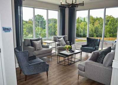 Bright common area with seating and large windows