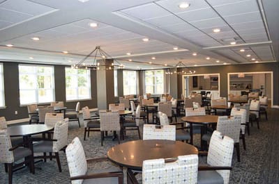 Dining area with tables and chairs in a well-lit room