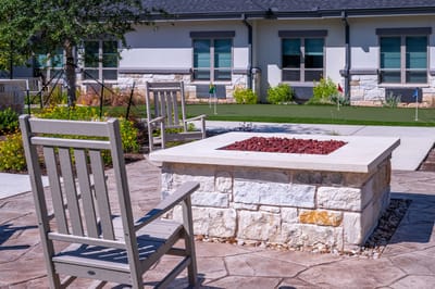 Outdoor seating area with a fire pit and putting green
