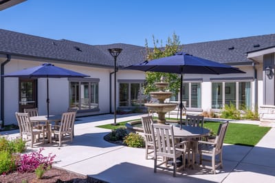 Outdoor courtyard with tables and umbrellas