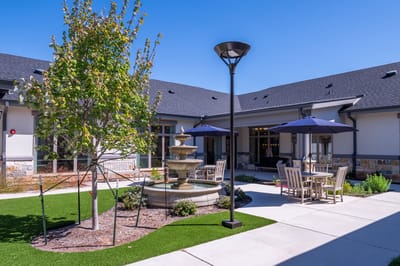 Outdoor courtyard with a fountain and seating area
