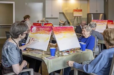 Residents painting during an art activity