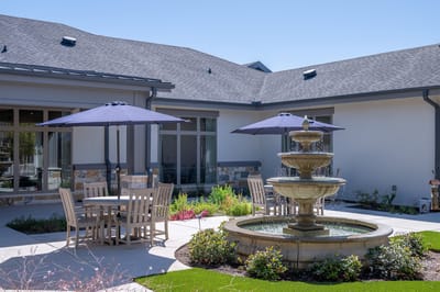 Outdoor courtyard with fountain and seating area