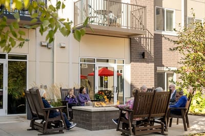 Residents enjoying the outdoor seating area