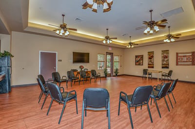 Bright common area with chairs arranged for a gathering