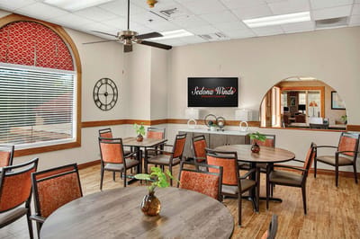 Bright dining area with tables and decorative elements