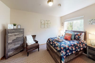 Cozy private resident room with floral bedding