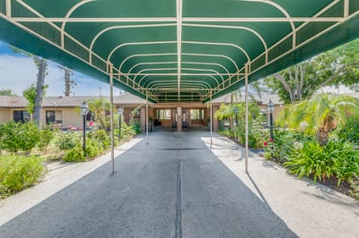 Covered entrance leading to a senior living facility