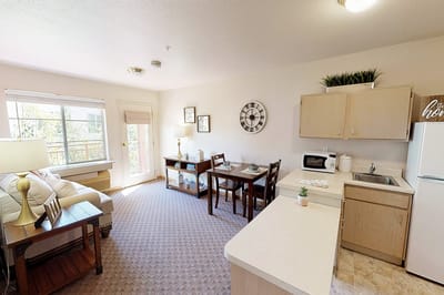 Bright interior view of a resident room with dining area