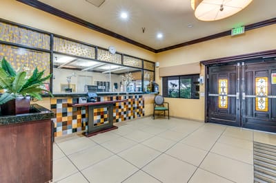 Interior lobby with a reception area and decorative accents