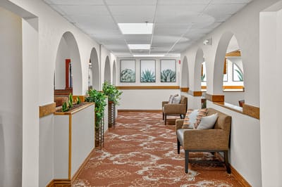 Bright interior hallway with seating and decor