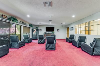 Common area with seating and a television setup