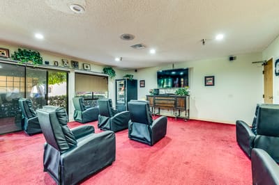Common area with seating and television