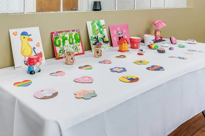 Table displaying residents' art and craft projects