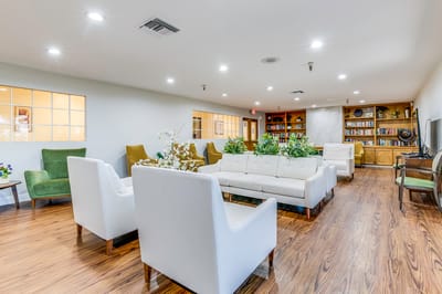 Bright common area with seating and bookshelves