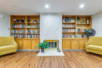 Cozy common area with bookshelves and seating