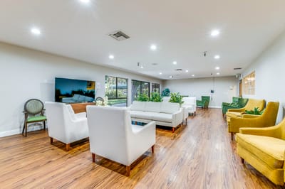 Bright and inviting common area with seating and plants