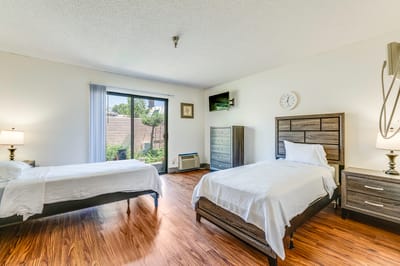 Brightly lit resident room with garden view