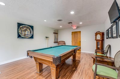 Interior view of a billiard room with a pool table