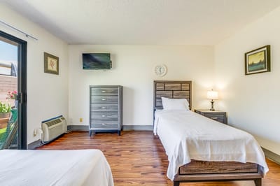 Interior view of a resident's room with beds and furniture