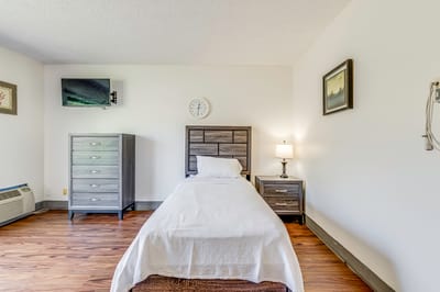 Private resident room with bed and furniture