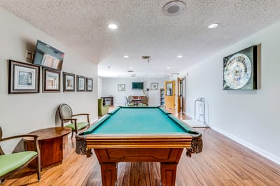 Interior view of a common area with a billiards table
