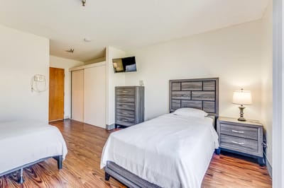 A simple interior shot of a resident room with two beds