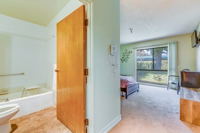 Interior view of a resident's room with a bathroom