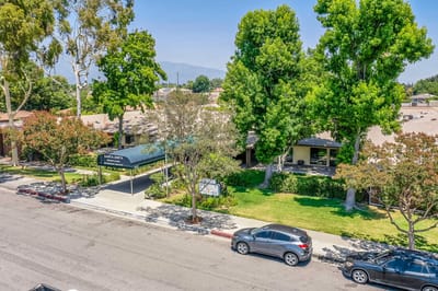 Exterior view of Santa Anita Assisted Living with landscaped area