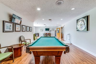 Interior view of a billiards room with a pool table