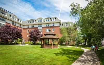 Outdoor view of a senior living facility with gazebo