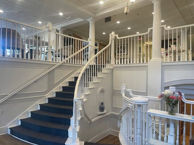 Elegant staircase in a well-lit lobby area