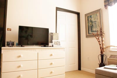Interior view of a resident's room with furniture.