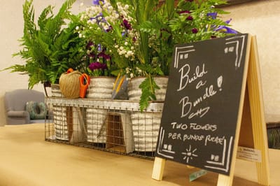 Table display with flowers and decorative sign